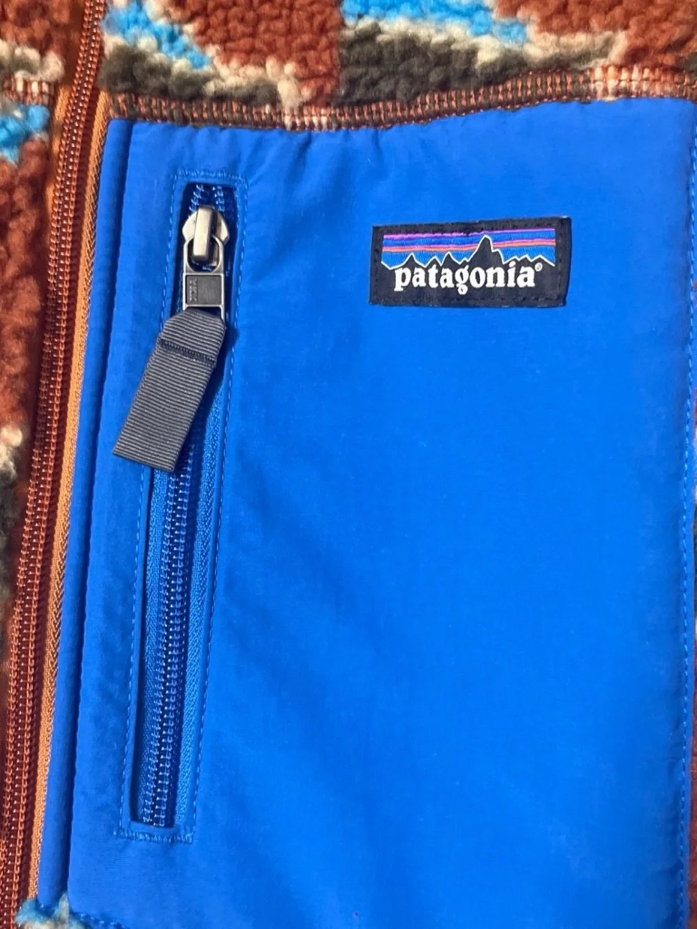 Patagonia sherpa fleece jacket in bright blue and brown pattern